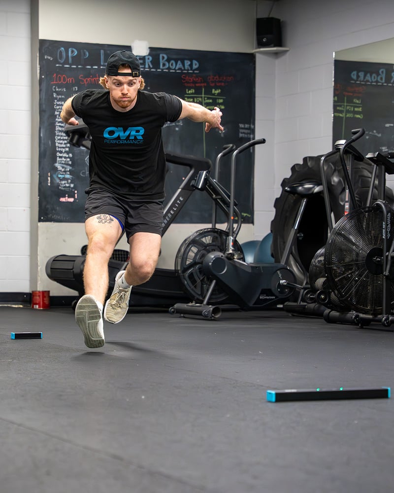 Athlete mid-jump with OVR Jump metrics floating in scene