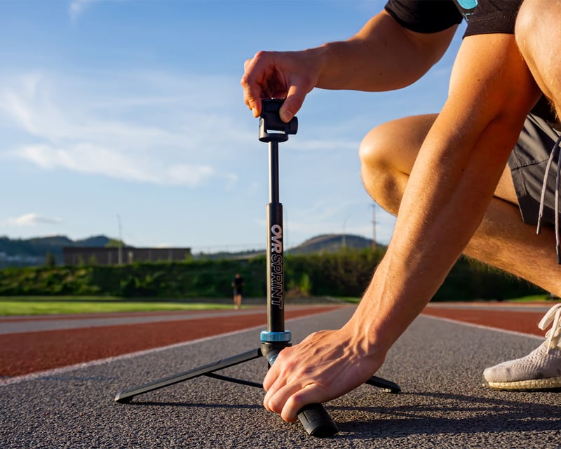 Athlete sprinting through OVR Sprint timing gates