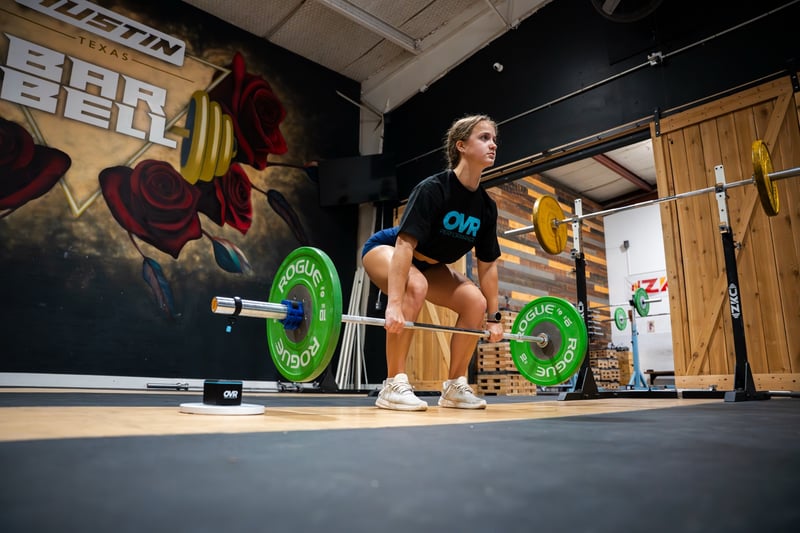 Athlete deadlifting while OVR Velocity tracks bar speed for fatigue